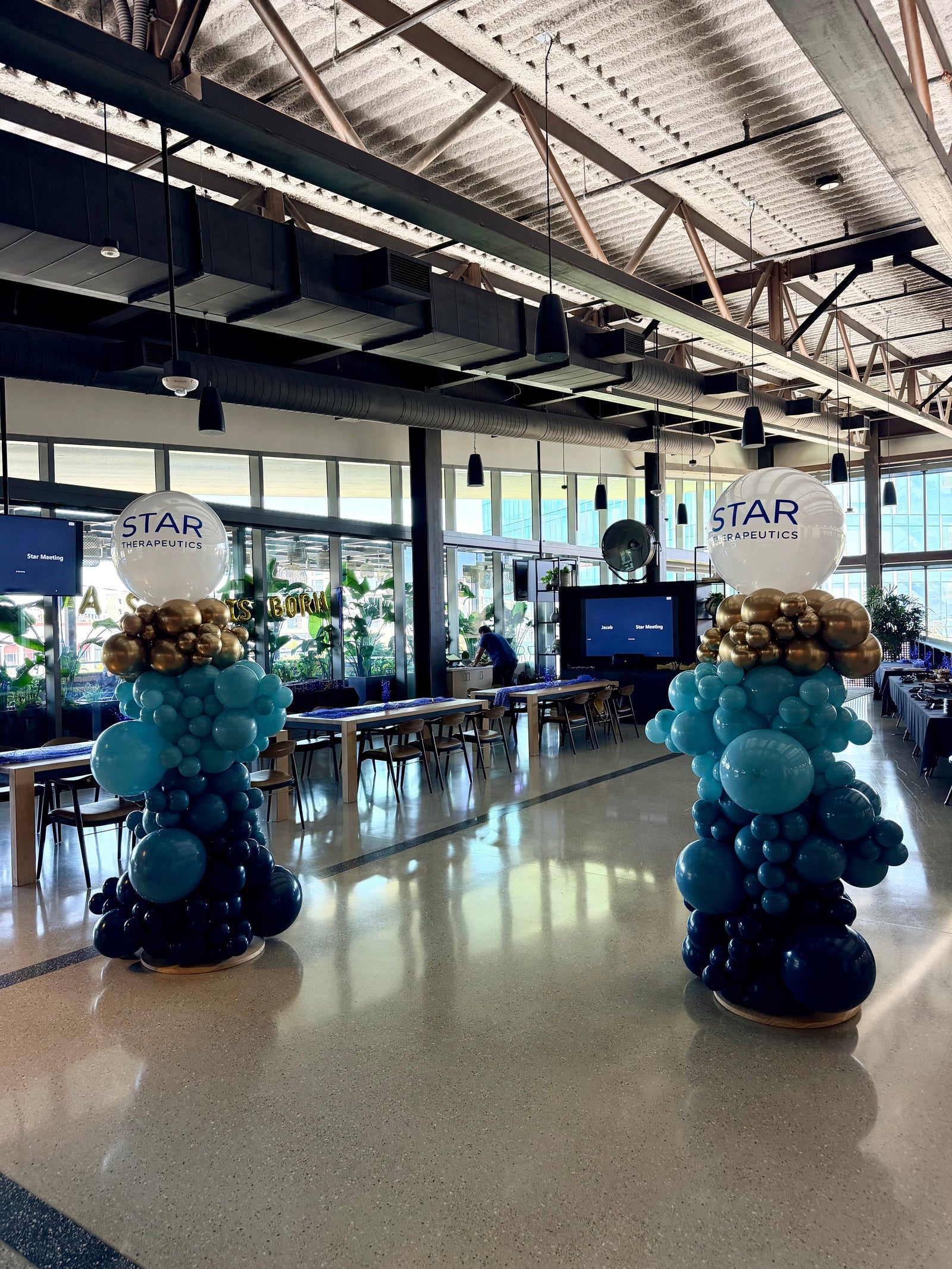 Professional blue and metallic corporate balloon columns demonstrating color and size combinations