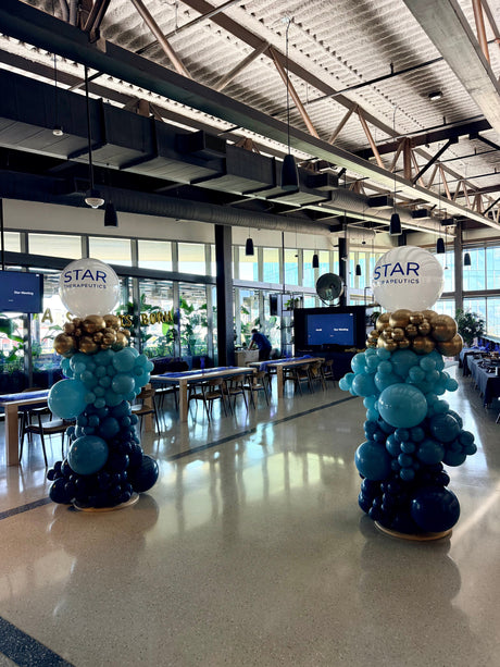 Professional blue and metallic corporate balloon columns demonstrating color and size combinations